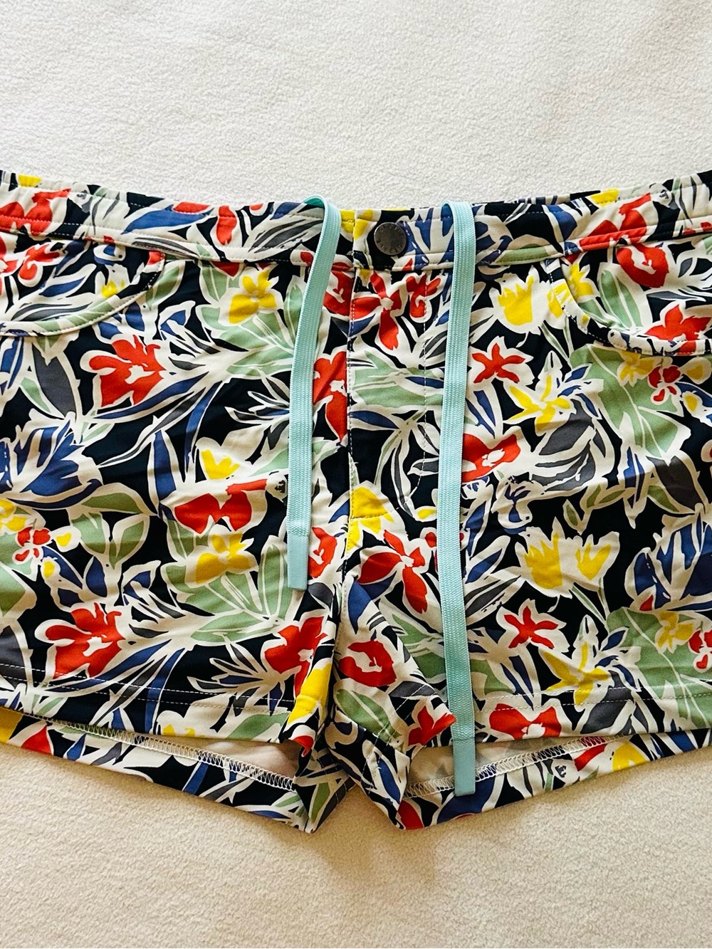 Men’s Steele Swimwear tropical floral swim trunks in size Medium.